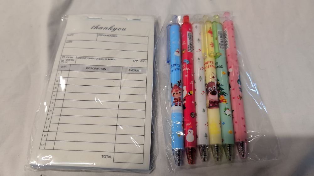 Lot 521: Two Stationery Items Comprising a thankyou Branded Order Pad and a Set of Festive Retractable Pens