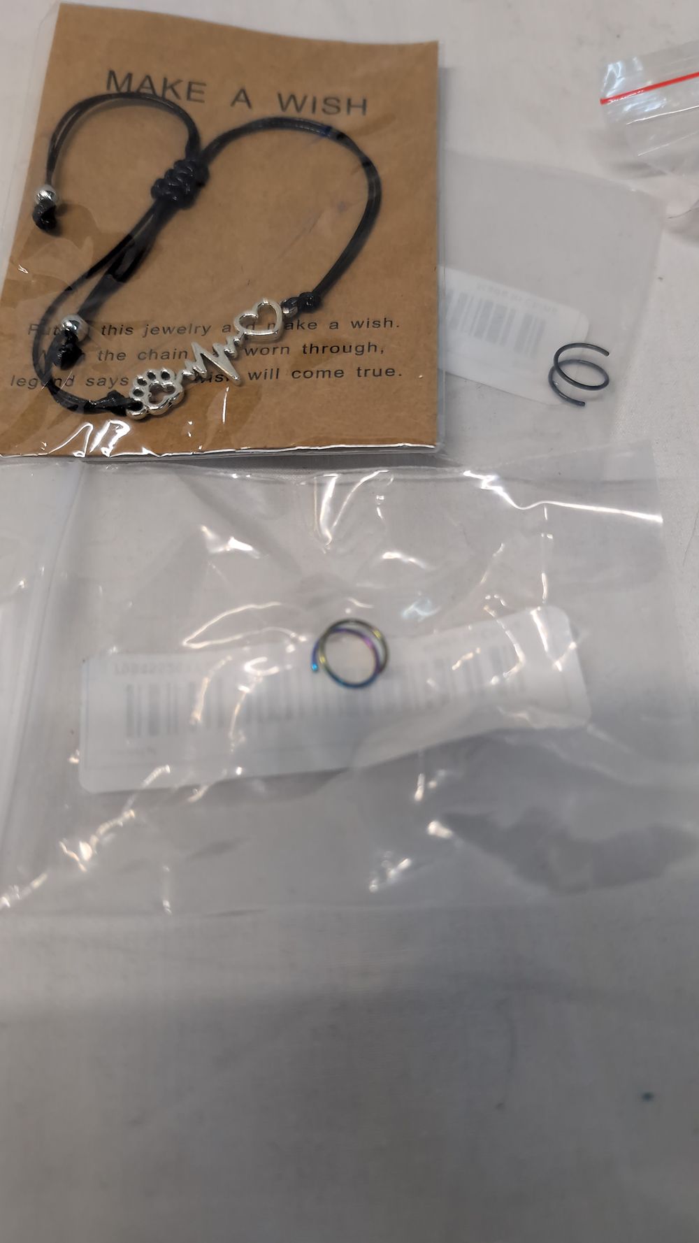 Lot 522: A Collection of Costume and Body Jewellery Including a Charm Bracelet and Hoops