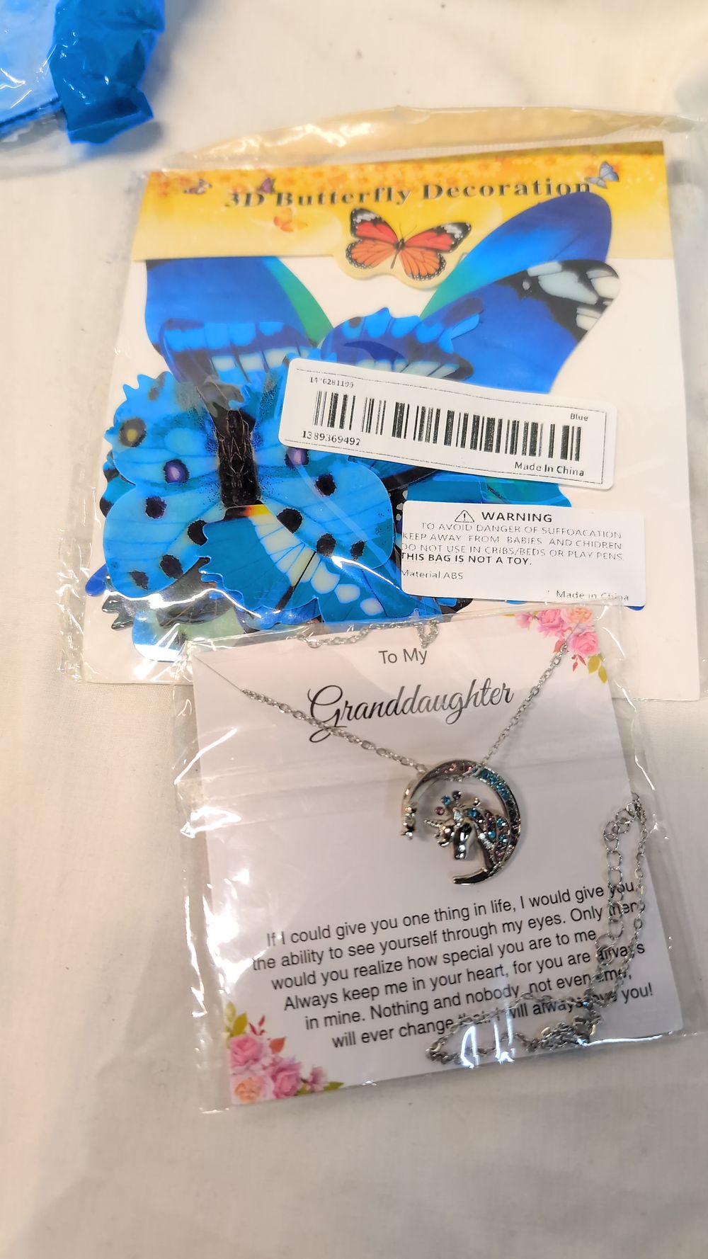 Lot 523: Two Items comprising a Costume Jewellery Necklace and a Set of Butterfly Wall Decals