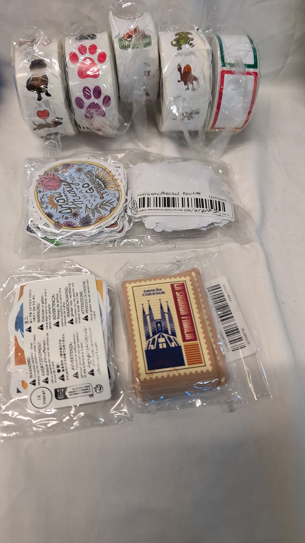 Lot 524: An Assortment of Adhesive Sticker Rolls and Themed Sticker Packs