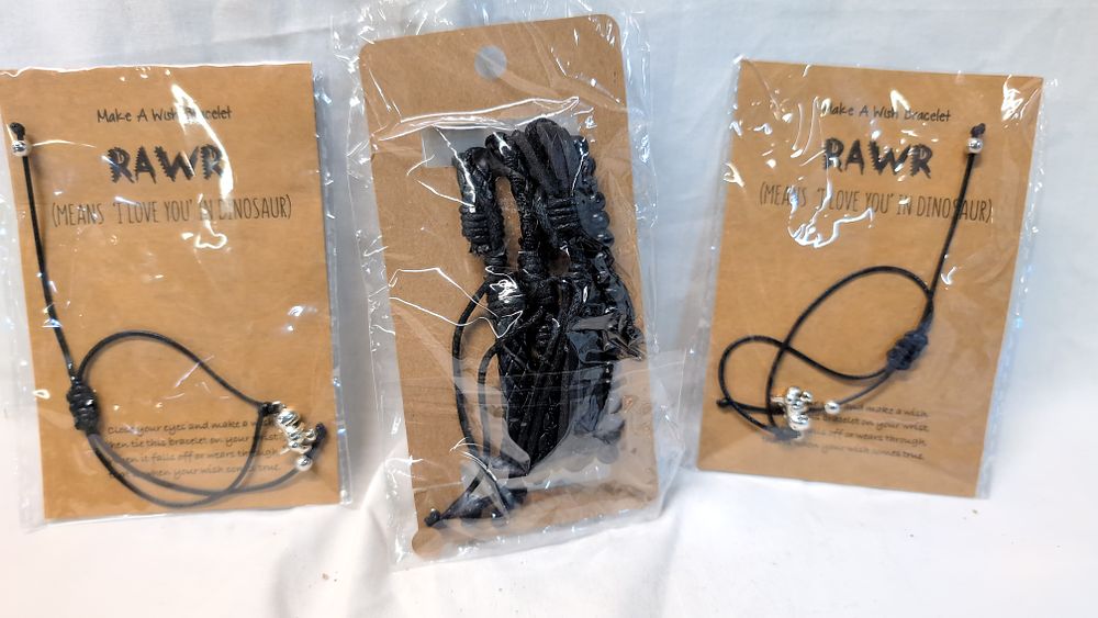 Lot 533: A Trio of Dinosaur Theme Make A Wish Cord Bracelet and Necklaces