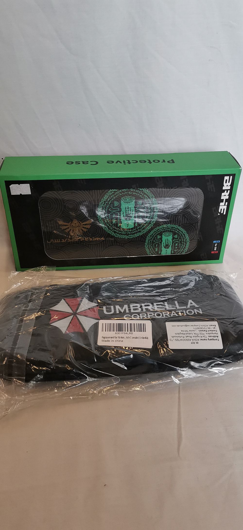 Lot 554: A Pair of Nintendo Switch Protective Carrying Cases, Zelda and Resident Evil Themes