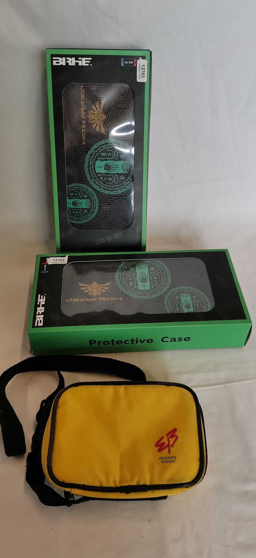 Lot 560: Three Video Game Console Carrying Cases including BIRHE Zelda Tears of the Kingdom Theme Switch Cases and Electronics Boutique Bag