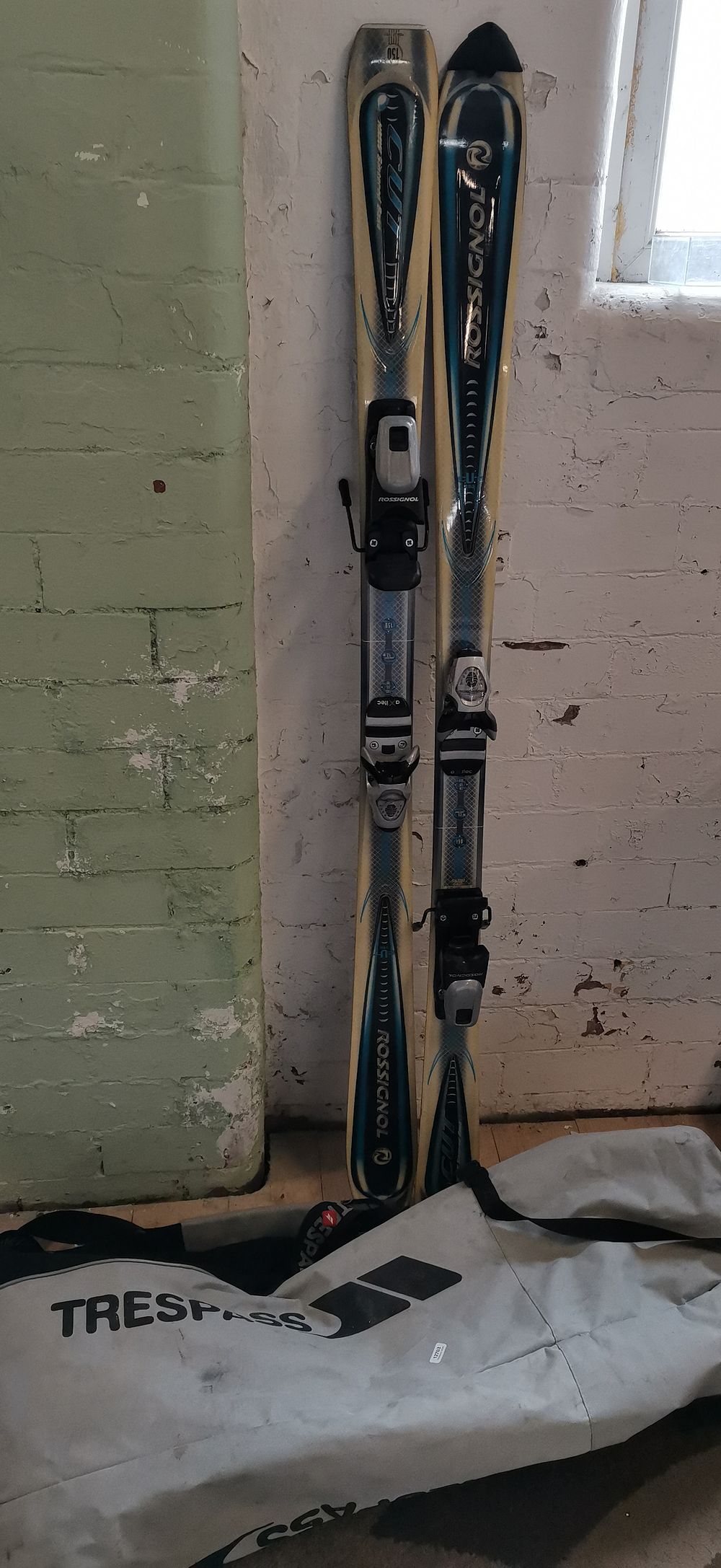 Lot 563: A Pair of Rossignol Cut Downhill Skis with Bindings and Carry Bag