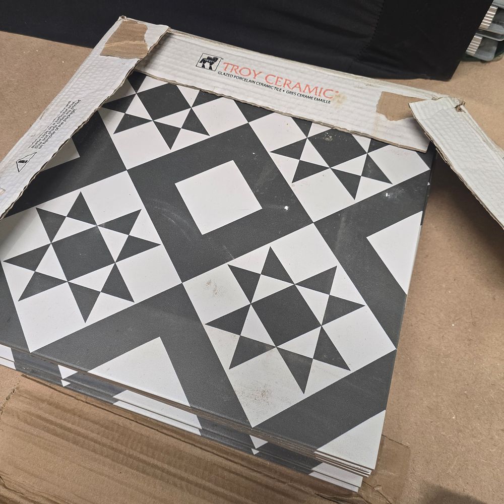 Lot 735: A Set of Troy Ceramic Glazed Porcelain Geometric Patterned Tiles