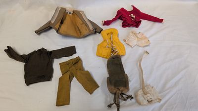 An Assortment of Vintage G.I. Joe and Big Jim Action Figure Clothing and Accessories. A 
