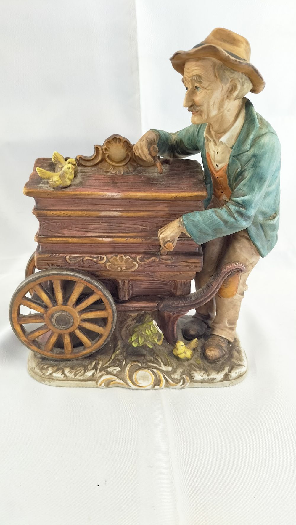 Lot 452: A Large Capodimonte Style Musical Ceramic Figurine of an Organ Grinder