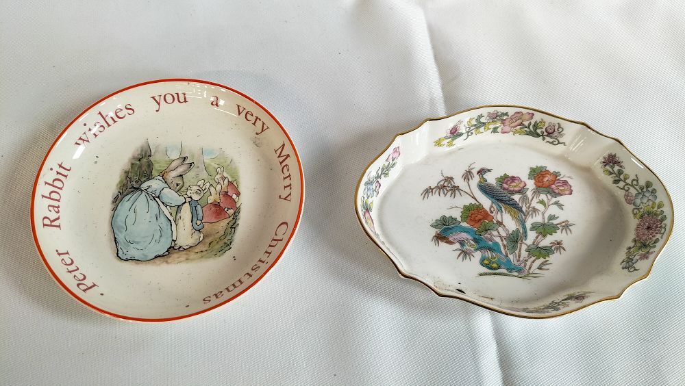 Lot 483: Two Wedgwood Ceramic Dishes comprising a Peter Rabbit Christmas Pin Dish and a Kutani Crane Pattern Scalloped Oval Dish