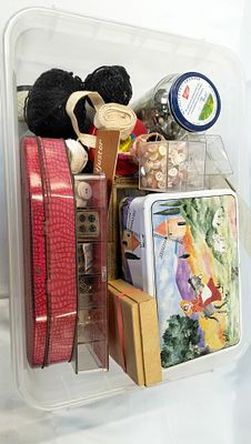 An Assortment of Vintage Sewing Notions, Supplies, and Decorative Tins. A diverse collection of 