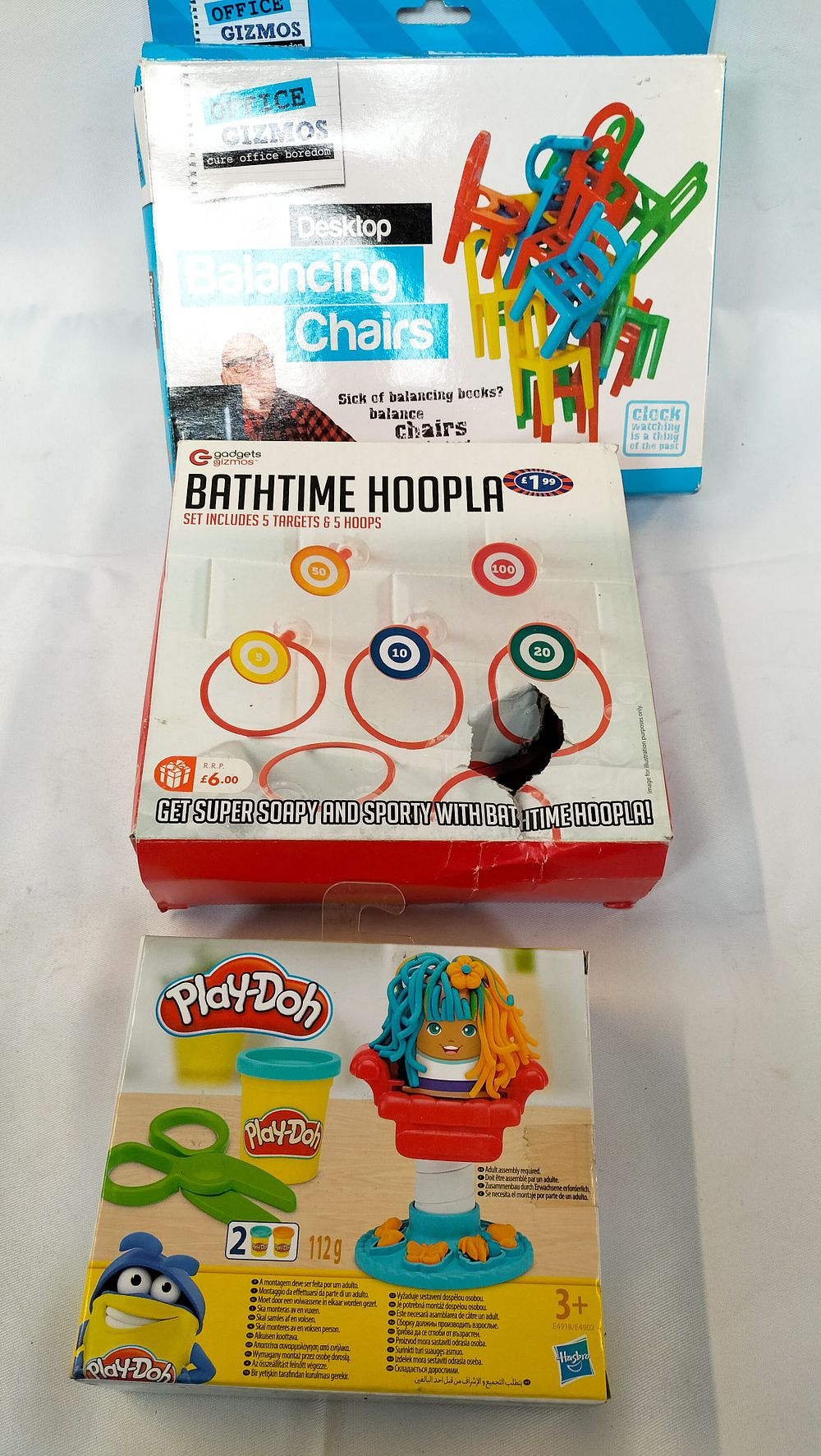 Lot 634: Three Boxed Contemporary Games and Toys including Play-Doh Mini Hair Salon, Desktop Balancing Chairs, and Bathtime Hoopla
