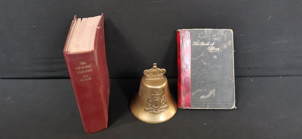 Lot 704: Three Items Including Methodist Religious Books and a Brass Bell
