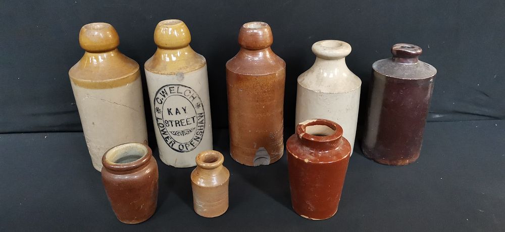 Lot 710: A Collection of Antique Stoneware and Glass Bottles and Jars