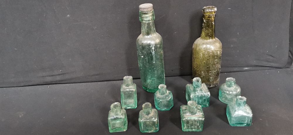 Lot 711: A Collection of Antique Glass Bottles and Inkwells