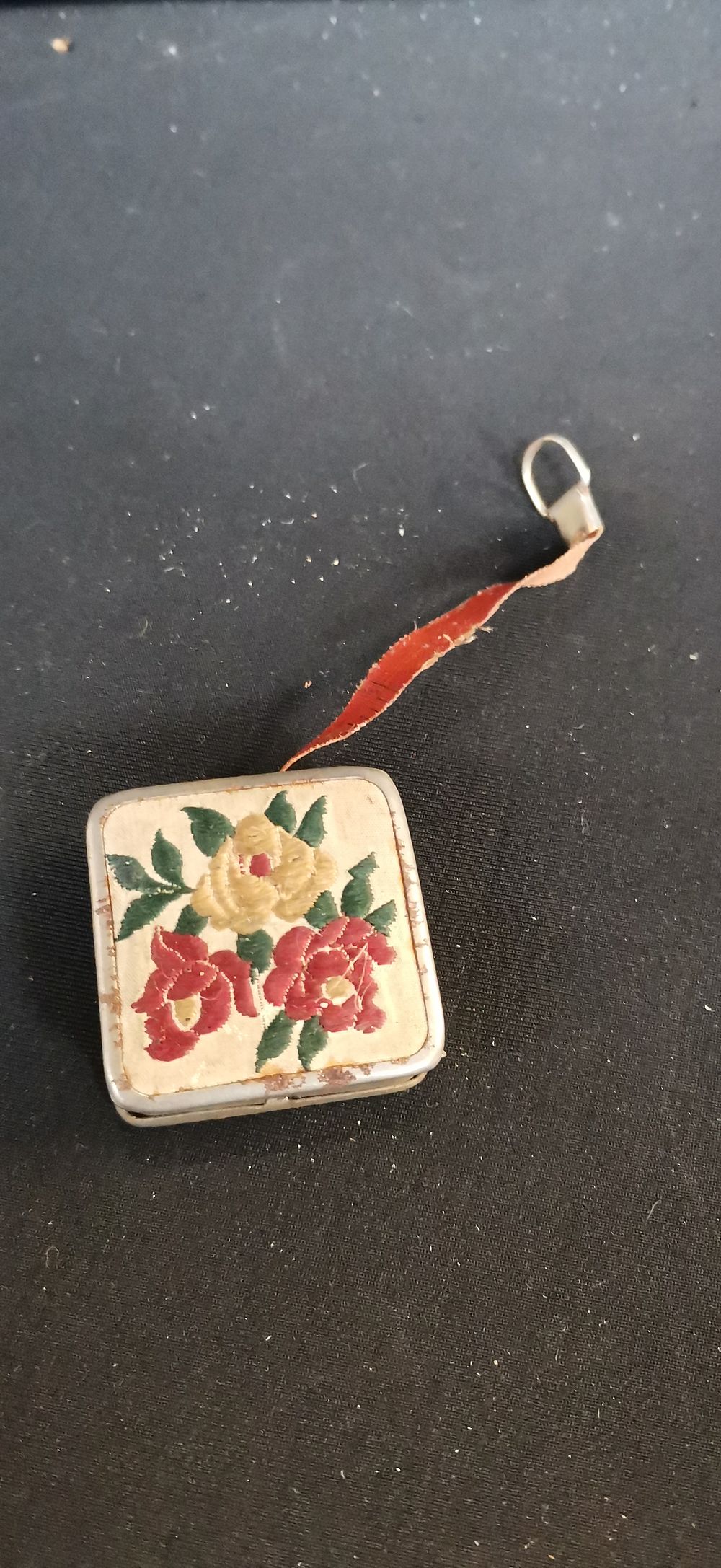 Lot 713: Vintage German Floral and Blue Panel Retractable Tape Measure