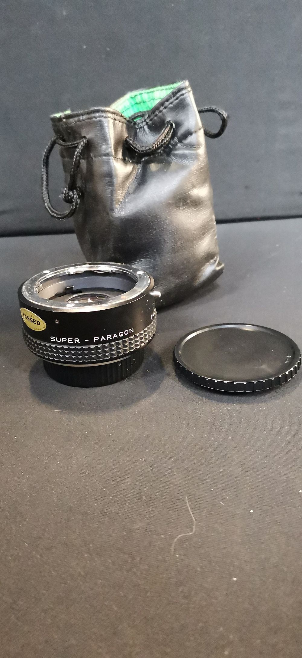 Lot 716: Super Paragon PMC X2 Converter with Lens Cap and Pouch