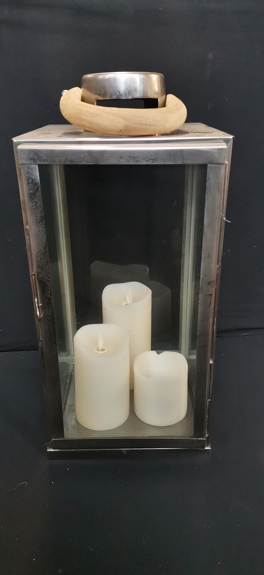 Lot 727: Metal and glass lantern with wooden handle and LED candles