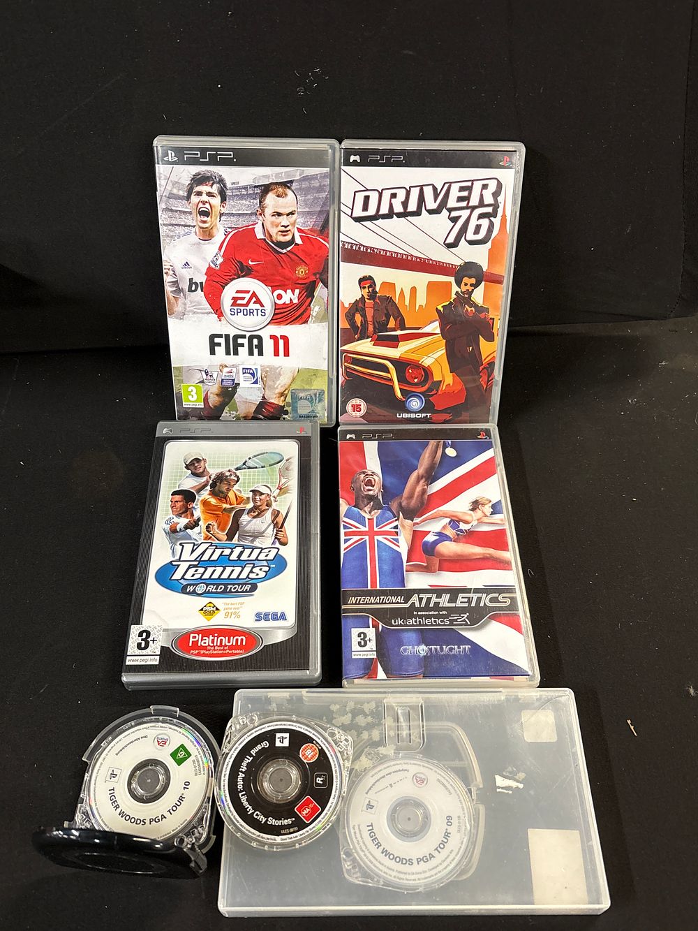 Lot 752: A Collection of 7 Sony PSP Games including Grand Theft Auto and FIFA 11