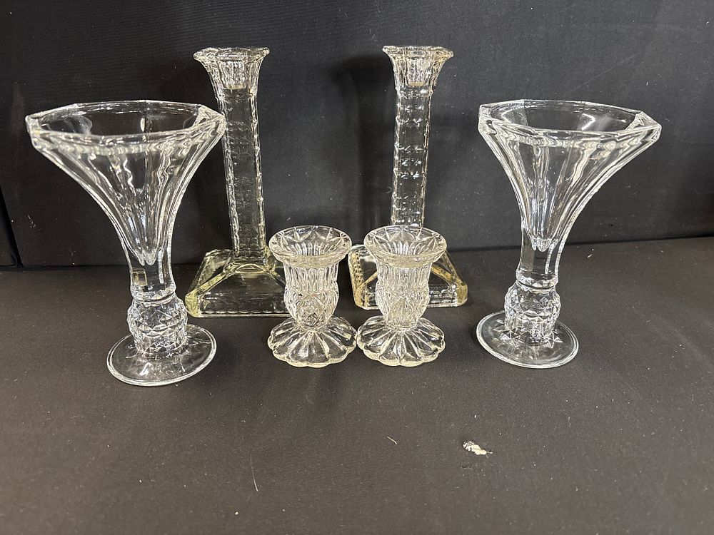 Lot 773: A collection of six cut glass items including a pair of trumpet vases and four candlesticks