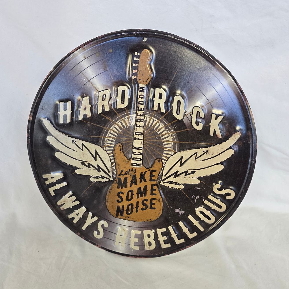 Lot 806: Circular Embossed Metal Hard Rock Theme Replica Wall Sign