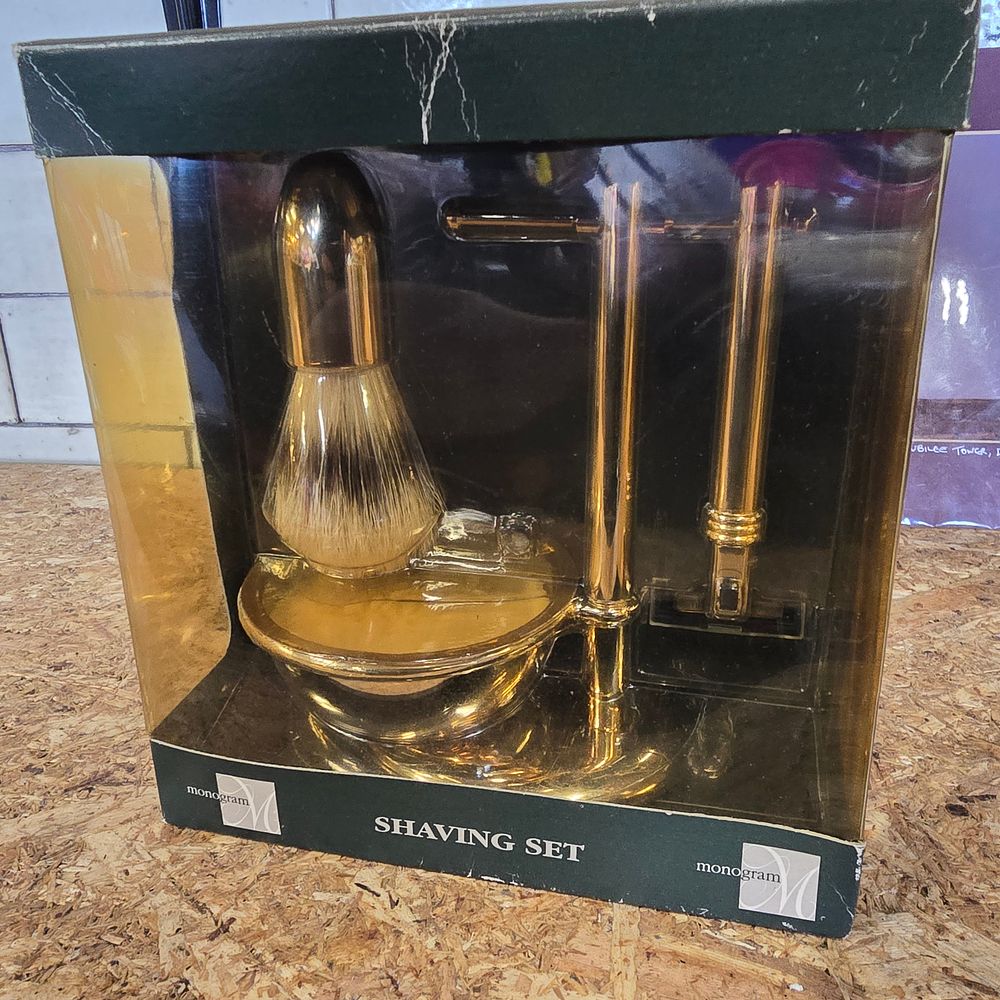 Lot 893: A Monogram Brass Shaving Set by Boots