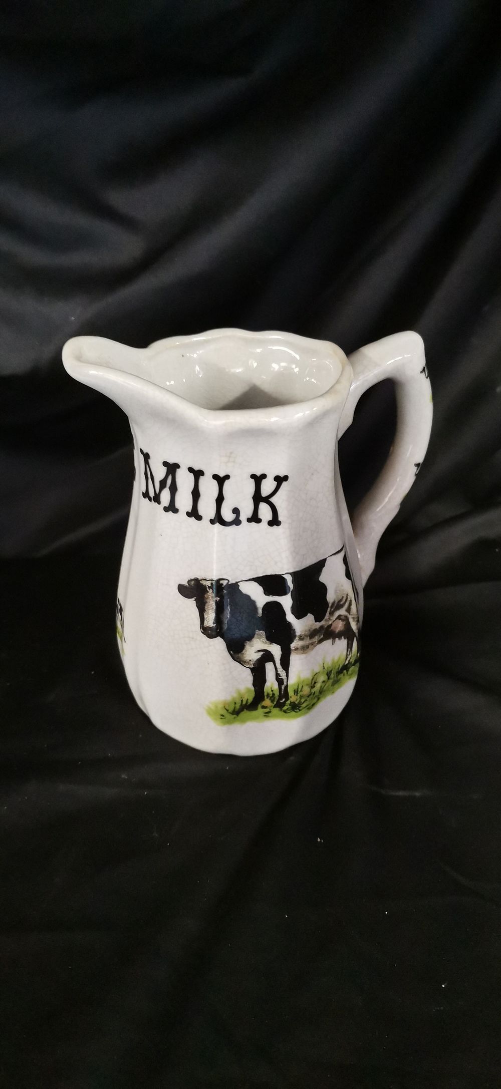 Lot 911: Pure Milk Ceramic Advertising Dairy Pitcher with Cow Illustrations