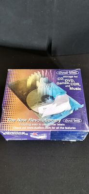 Dual Box CD and DVD Storage Case System with Integrated Printer Labels. A retail-packaged Dual 