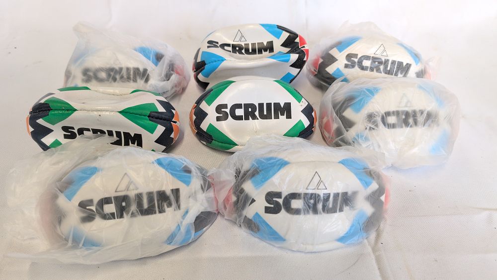 Lot 176: Eight Miniature Scrum Promotional Rugby Balls