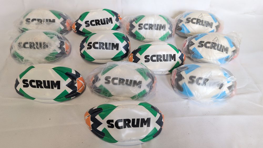 Lot 177: Twelve Miniature Scrum Promotional Rugby Balls