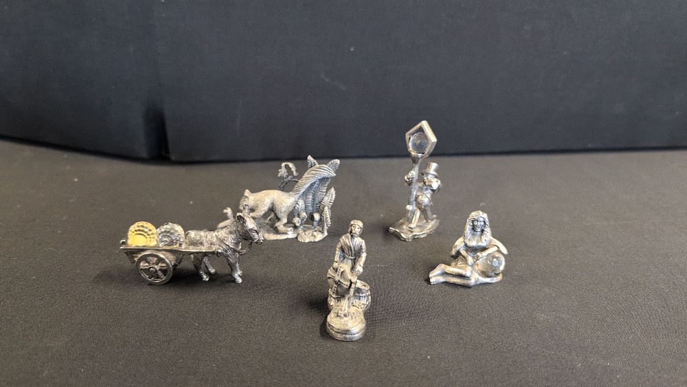 Lot 381: A Collection of Five Pewter and Crystal Set Decorative Figurines