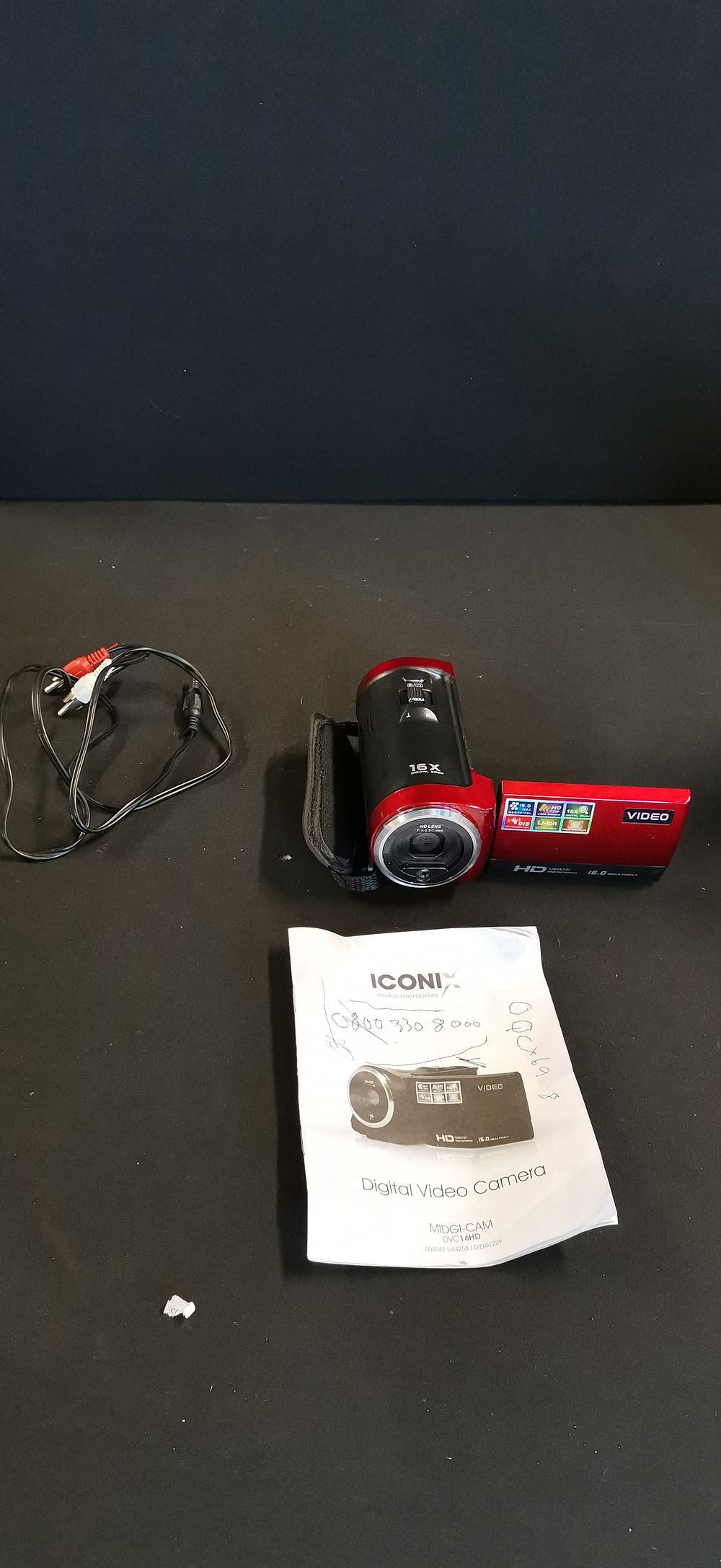 Lot 395: Iconix Midgi-Cam DVC16HD Digital Video Camera with Original Box and Accessories. Tested for Power