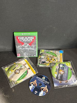 A Collection of Xbox One Video Games and a Sports DVD. A collection of Xbox One video games and 