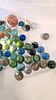 An Assortment of Coloured Glass Marbles with Cat's Eye and Swirl Patterns. A collection of glass Image - 2