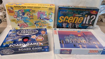 A Collection of Four Board Games and Jigsaw Puzzles Including Ravensburger and Harry Potter 