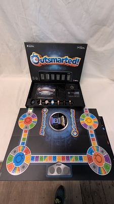 Outsmarted! The Live Quiz Show Board Game by QPlay. Unchecked. Outsmarted! The Live Quiz Show 