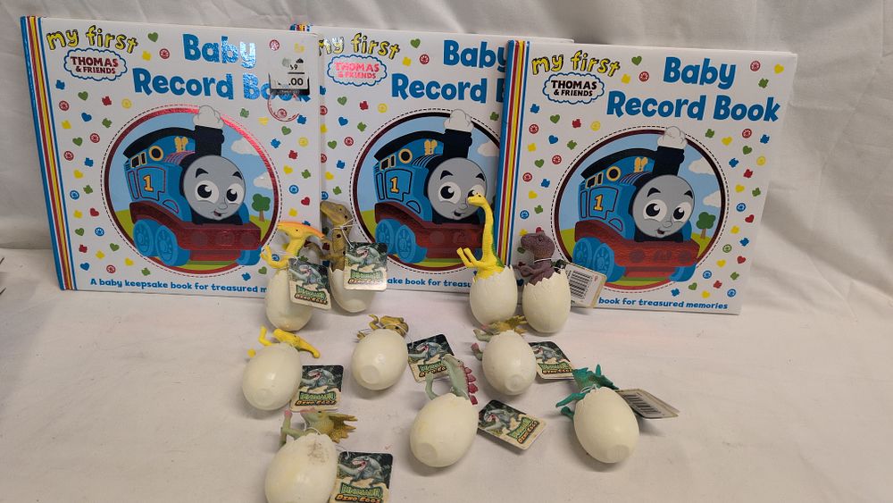 Three My First Thomas & Friends Baby Record Books and Ten Dinosaur Dino Egg Toy Figures. A 