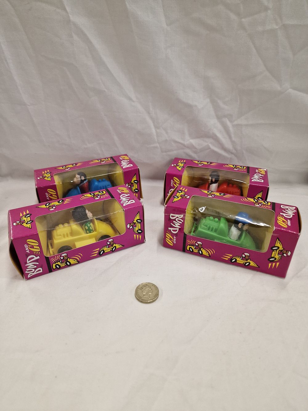 Lot 755: A Group of Vintage Bump and Go Plastic Toy Racing Cars, Attributed to Brooke Bond PG Tips