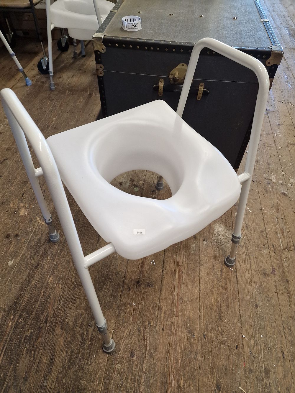 Lot 763: An Adjustable Raised Toilet Seat and Surround Frame