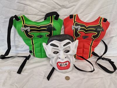 Three Pieces of Child's Costume and Role-Play Plastic Accessories Including a Vampire Mask. A 