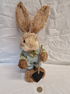 A Decorative Rabbit Figurine with Garden Shovel. A seasonal decorative rabbit figurine 