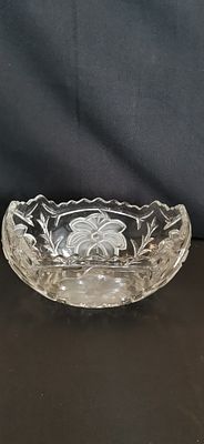 A mid-20th-century frosted and cut glass oval bowl. An oval glass bowl featuring a combination 