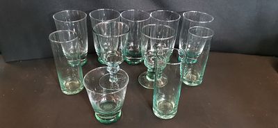 An Eleven Piece Suite of Contemporary Weighted Base Glassware with Teal Green Tints. This 