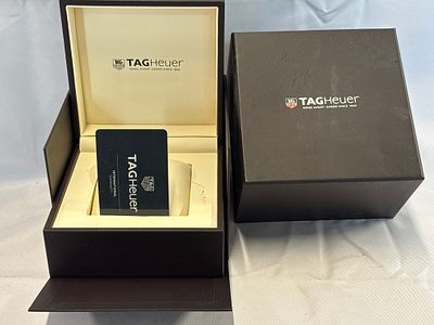 A TAG Heuer Watch Presentation Box Set and International Warranty Card. A TAG Heuer watch 