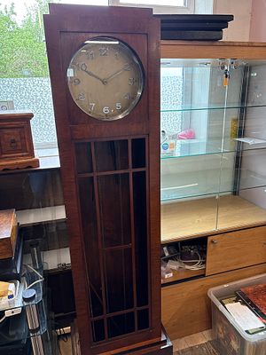 An Art Deco Stained Wood Longcase Clock . An Art Deco style longcase clock featuring a 