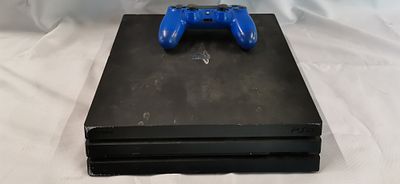 Sony PlayStation 4 Pro Console. Tested for Power in Black. No Power Supply with Blue DualShock 