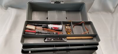 An Assortment of Artist's Materials and Tools in a Cantilever Utility Box. An assortment of 