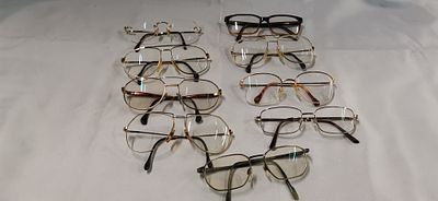 Nine pairs of vintage and contemporary eyewear including Rodenstock and Matrix frames. A 