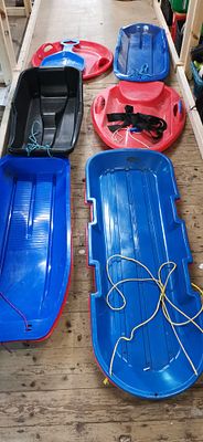 A Collection of Plastic Sledges and Toboggans Including a Mailbox Stockport Example. Ideal for 