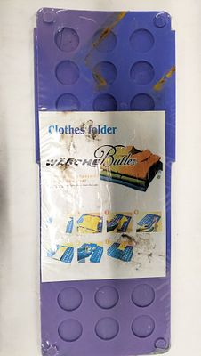 Two Plastic Clothes Folding Boards. A pair of plastic clothes folding boards, comprising one 