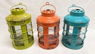 Three Decorative Nautical-Style Metal and Glass Lanterns. A trio of decorative lanterns in a 