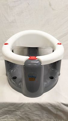 An ebebek Baby Plus Baby Bath Seat. An ebebek Baby Plus baby bath seat constructed from moulded 